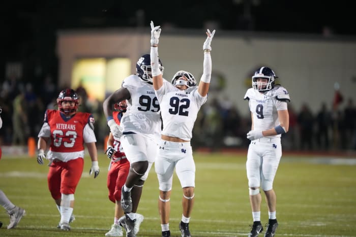 Vandegrift players celebrate a big play during a 5A Division I state semifinal blowout of Brownsville Veterans.